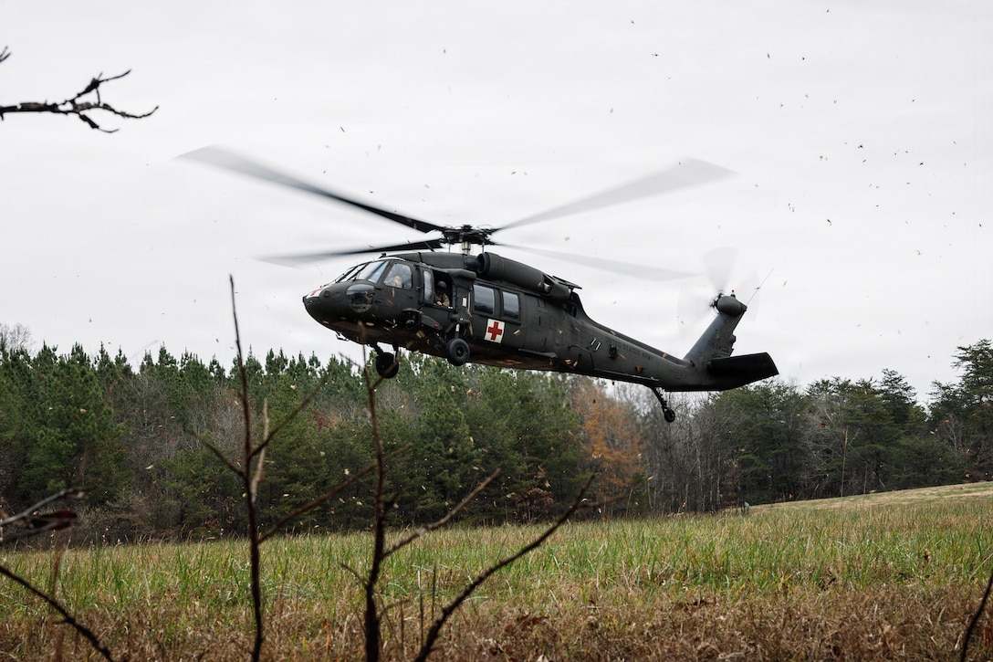 A U.S. Army UH-60 Blackhawk helicopter lands during a simulated casualty evacuation during the Warfighting Field Exercise on Marine Corps Base Quantico, Virginia, Nov. 18, 2025. The WARFEX serves as the culminating event at TBS, evaluating students’ proficiency in decision-making, small-unit tactics, and leadership as they operate under sustained physical and mental pressure in a realistic warfighting scenario. (U.S. Marine Corps photo by Cpl. Joshua Barker)