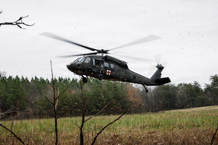 A U.S. Army UH-60 Blackhawk helicopter lands during a simulated casualty evacuation during the Warfighting Field Exercise on Marine Corps Base Quantico, Virginia, Nov. 18, 2025. The WARFEX serves as the culminating event at TBS, evaluating students’ proficiency in decision-making, small-unit tactics, and leadership as they operate under sustained physical and mental pressure in a realistic warfighting scenario. (U.S. Marine Corps photo by Cpl. Joshua Barker)