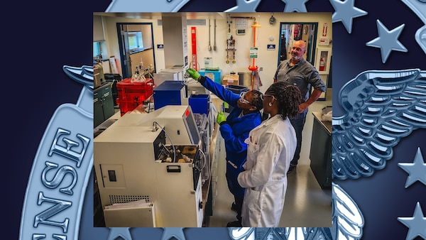 Three people work in a lab.