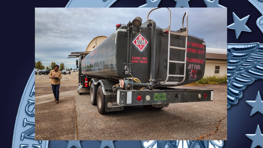 Woman inspects fuel vehicle.