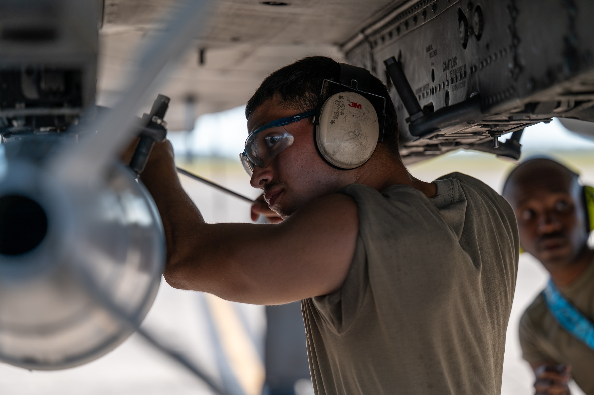 Man works on an aircraft.