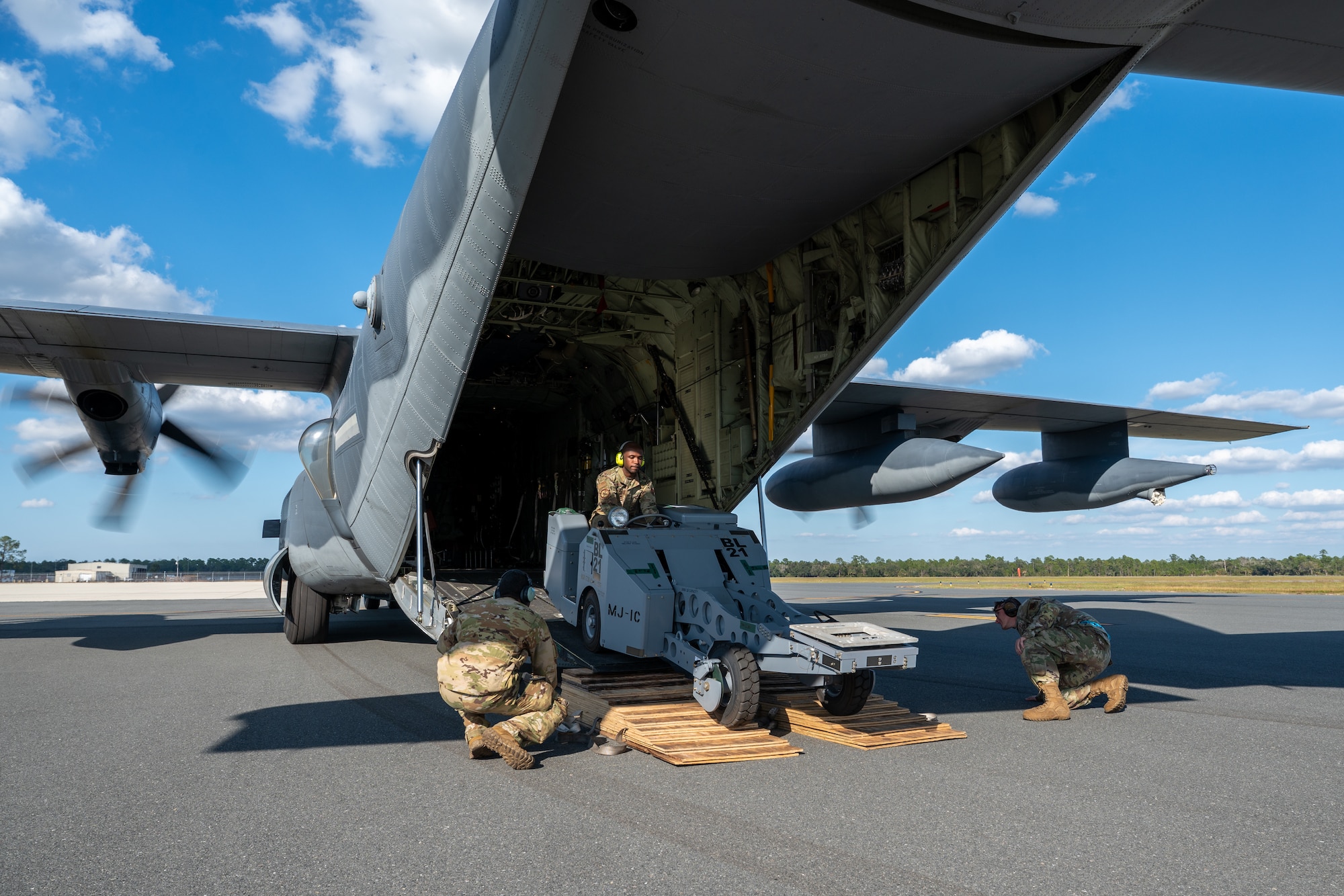 A vehicle is driven out of an aircraft.