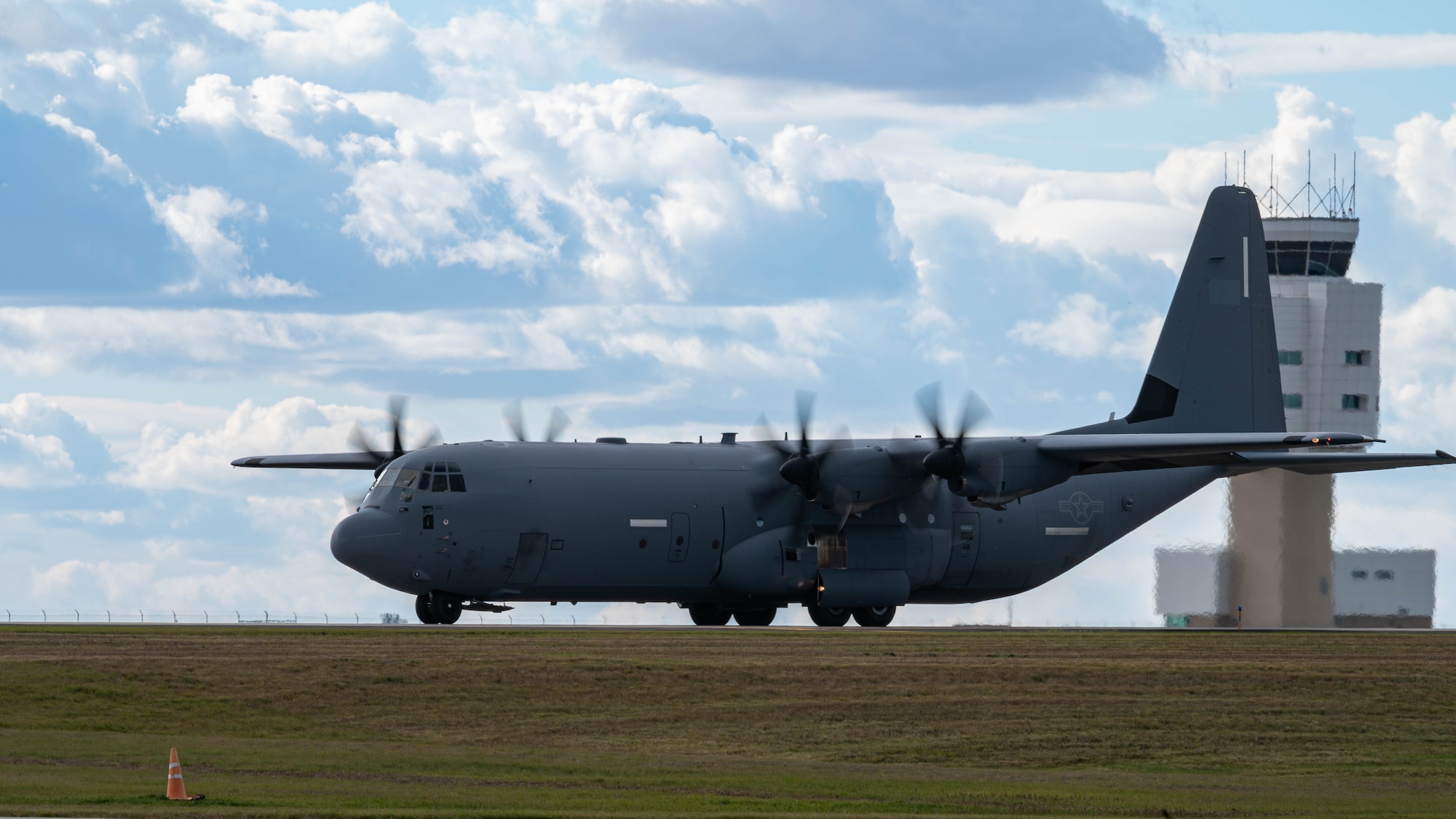 A c-130 parks on the flightline