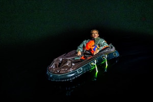 U.S. Air Force Staff Sgt. Blake Hawley, 23d Logistics Readiness Squadron air transportation function specialist floats in a raft during exercise PR Pulse in the Gulf of America on Nov. 19. 2025. Exercise PR Pulse demonstrated the vital role of the 347th Rescue Group’s personnel recovery operations in supporting the 23d Wing’s missions under realistic conditions for exercise Mosaic Tiger 26-1. (U.S. Air Force photo by Senior Airman Savannah Carpenter)