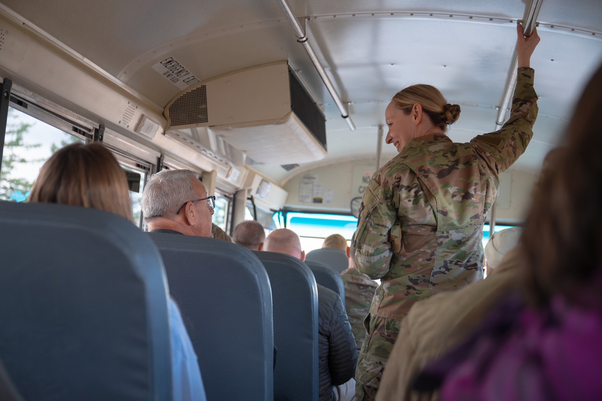 Uniformed personnel speaks to man