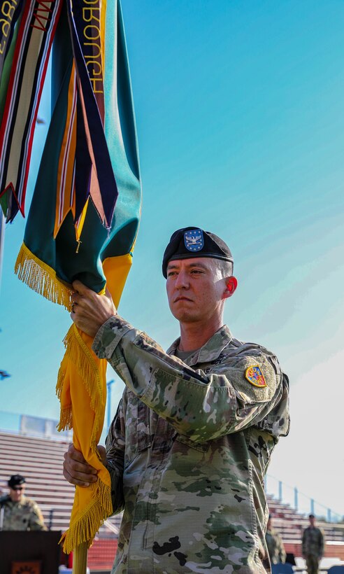 U.S. Army Col. Terry Durham receives the colors of the 149th Maneuver Enhancement Brigade (MEB) while assuming command during a ceremony in Richmond, Ky., Oct. 18, 2025.