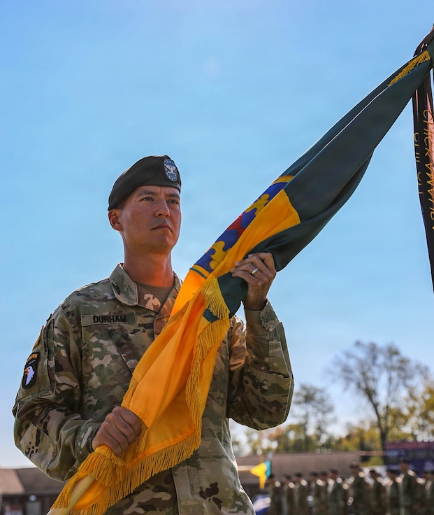 U.S. Army Col. Terry Durham receives the colors of the 149th Maneuver Enhancement Brigade (MEB) as he assumes command during a ceremony in Richmond, Ky., Oct. 18, 2025.