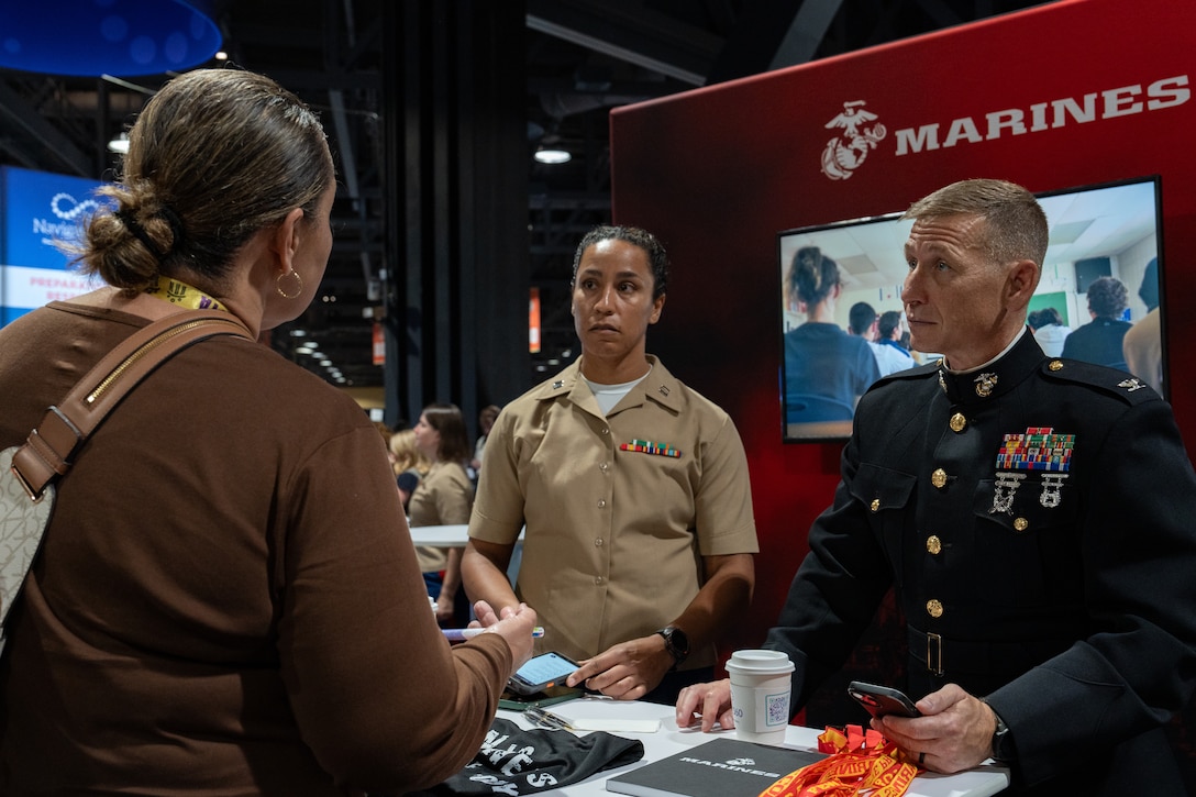 U.S. Marine Corps Capt. Briana Allen, left, a Marine officer instructor with the University of South Carolina, and Col. Jerome C. Greco, commanding officer for 12th Marine Corps District, speak with an attendee of the American School Counselor Association Conference in Long Beach, California, July 12, 2025. The annual ASCA School Counselor Conference is the organization’s largest gathering and the premier professional development conference for school counselors nationwide. (U.S. Marine Corps photo by Sgt. Fred Garcia)