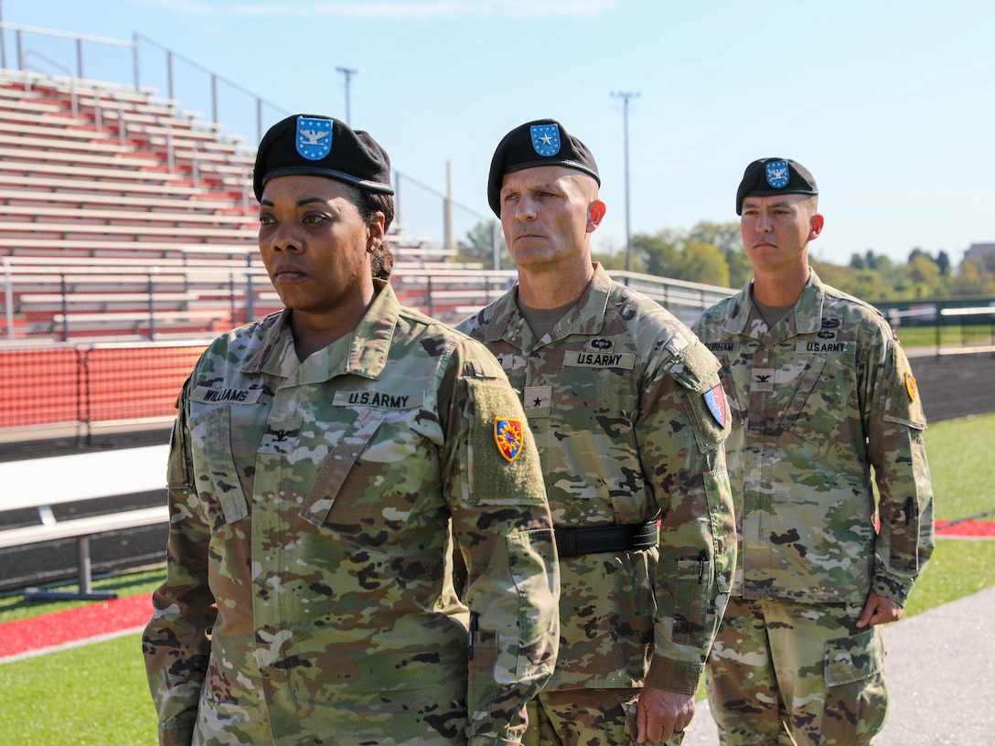 U.S. Army Col. Brandye Williams, Brig. Gen. Joseph Gardner, and Col. Terry Durham stand at attention during the 149th Maneuver Enhancement Brigade change of command ceremony in Richmond, Ky., Oct. 18, 2025.