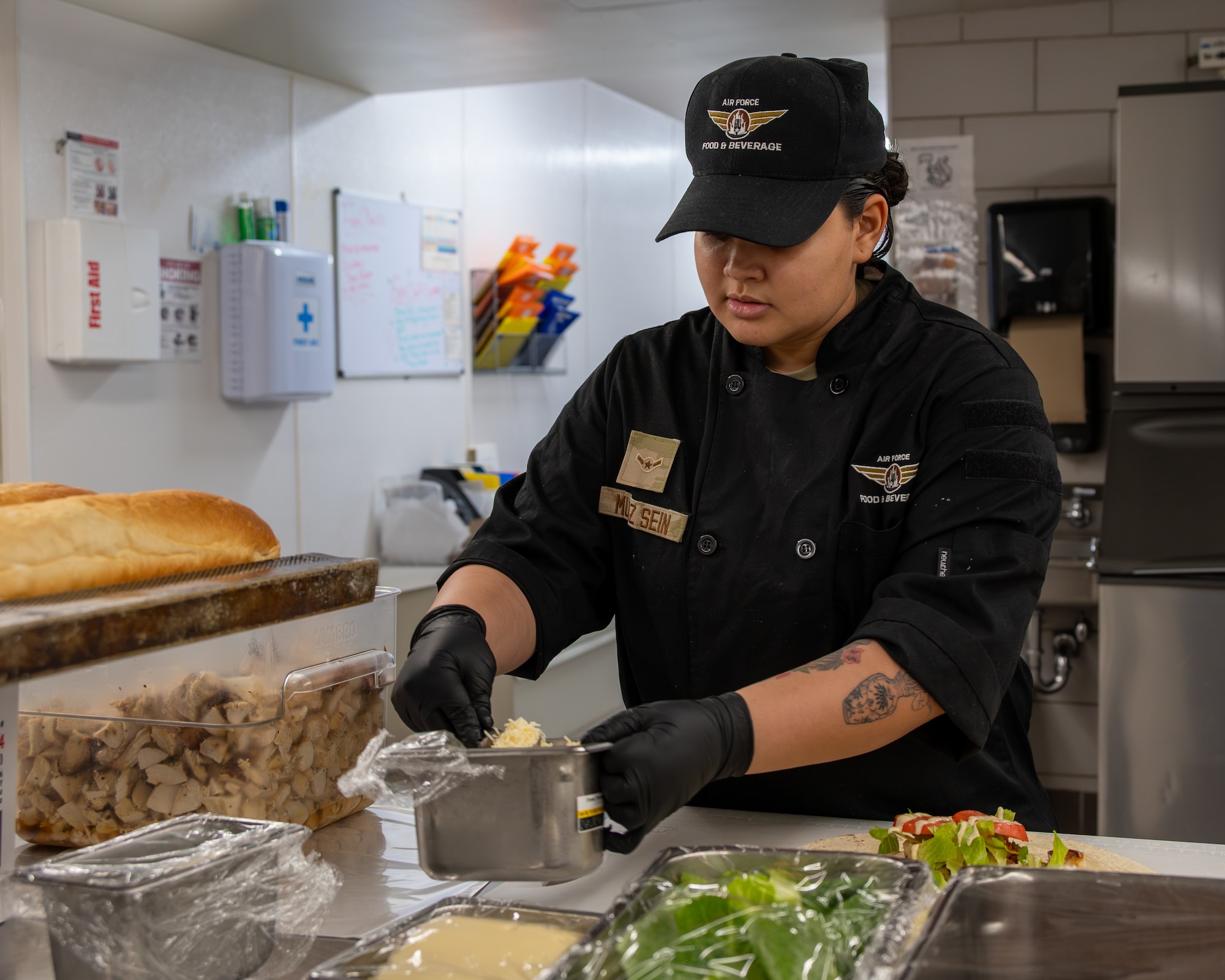 Uniformed personnel prepares food