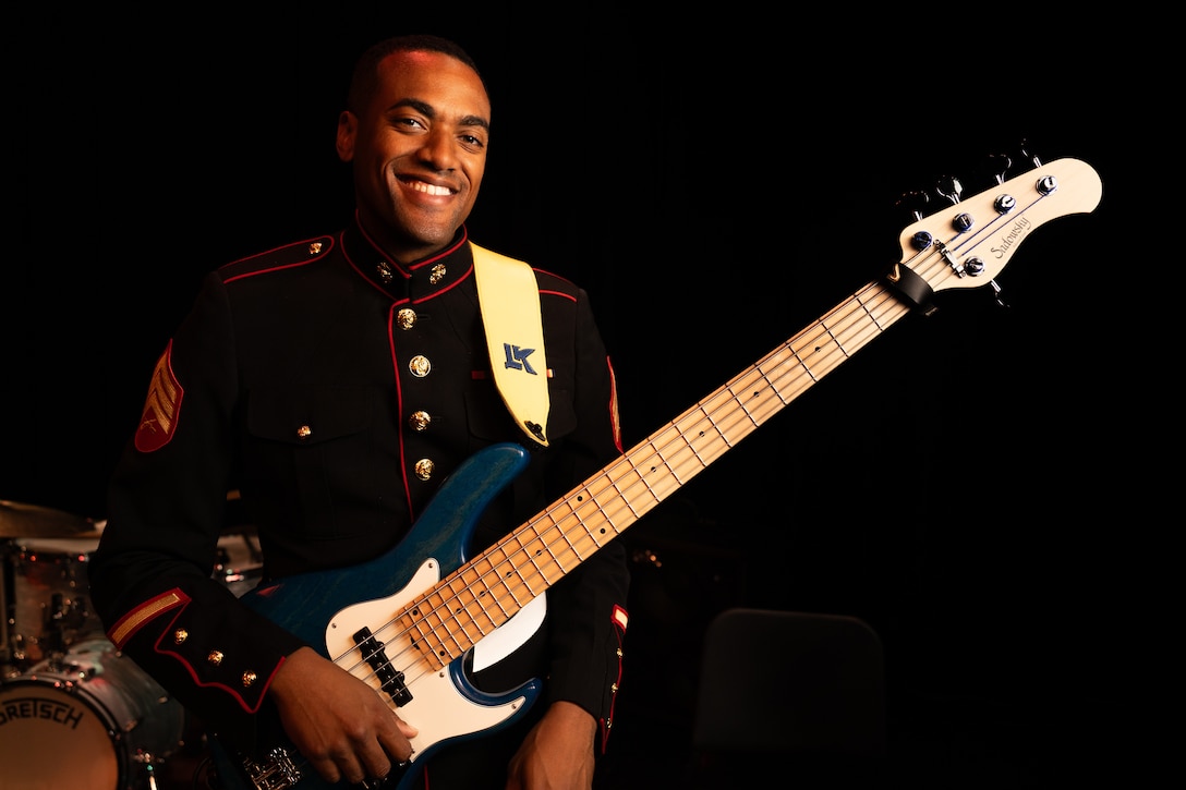 U.S. Marine Corps Sgt. Andre Phanor, an electric bassist with 3rd Marine Aircraft Wing Band, poses for a photograph at the conclusion of a performance at the University of Alaska Anchorage in Anchorage, Alaska, Sept. 18, 2025. Members of the 3rd MAW and Marine Corps Recruit Depot San Diego Bands toured multiple schools in Alaska to improve community relations, increase morale, and spread awareness of Marine Corps opportunities. (U.S. Marine Corps photo by Sgt. Andrew Bray)