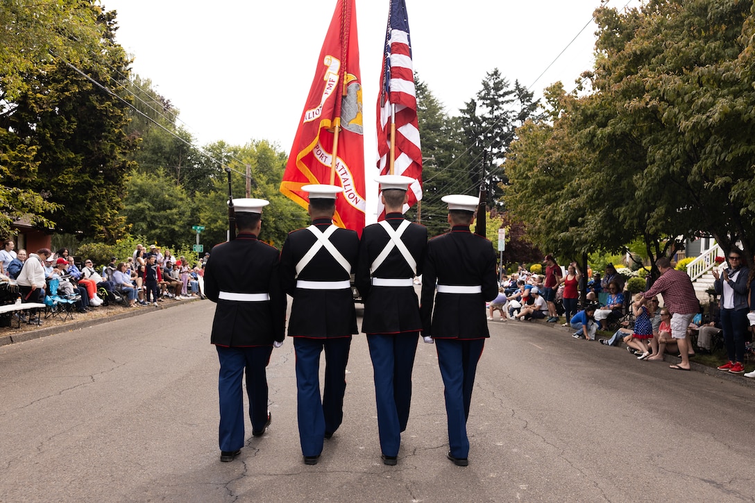 U.S. Marines with 6th Engineer Support Battalion, 4th Marine Logistics Group, serve as the color guard during the Hillsboro 4th of July Parade in Hillsboro, Oregon, July 4, 2025. The parade brings together service members and the local community in celebration of Independence Day. (U.S. Marine Corps photo by Sgt. Andrew Bray)