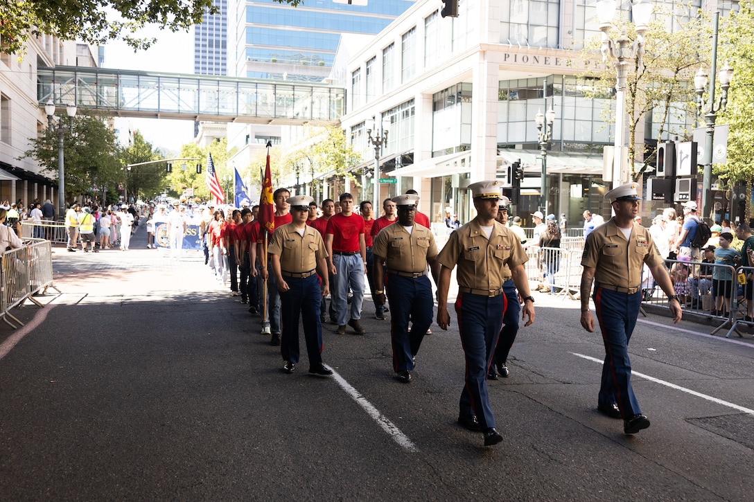 U.S. Marines and poolees with Recruiting Station Portland march in the Grand Floral Parade during Portland Fleet Week in Portland, Oregon, June 7, 2025. Portland Fleet Week is a time-honored celebration of the sea services and provides an opportunity for the citizens of Oregon to meet Sailors, Marines, and Coast Guardsmen, as well as witness firsthand the latest capabilities of today’s maritime services. (U.S. Marine Corps photo by Sgt. Andrew Bray)