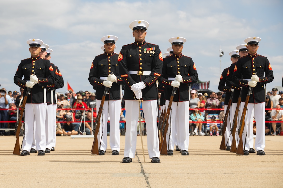 U.S. Marines with the United States Marine Corps Silent Drill Platoon, Alpha Company, Marine Barracks Washington, perform during the 2025 Marine Corps Air Station Miramar Airshow at MCAS Miramar in San Diego, California, Sept. 27, 2025. The MCAS Miramar Air Show provides a unique flight line experience with static displays and daytime shows that feature military demonstration teams, civilian acrobatic teams, aerial solo acts, vintage aircraft and war birds. (U.S. Marine Corps photo by Sgt. Bruin Largent)