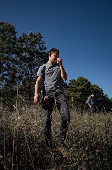 A Team Minot Airman scavenges for resources during combat survival training at Garrison, North Dakota, Oct. 9, 2025. In order to prepare for possible hostile scenarios, aircrew members must finish survival, evade, resistance and escape training. (U.S. Air Force photo by Senior Airman Alyssa Bankston)