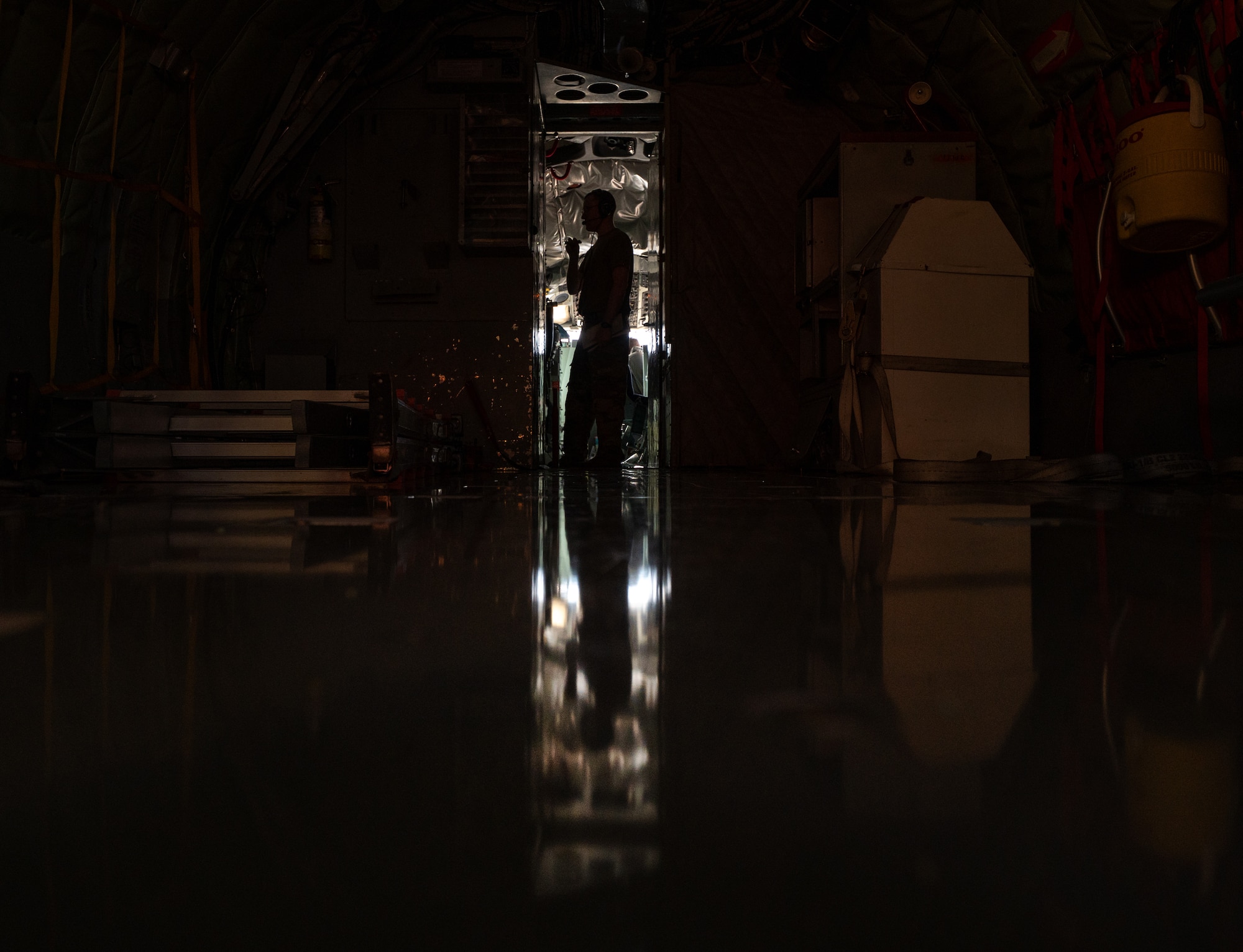 A U.S. Air Force Airman performs pre-flight checks.