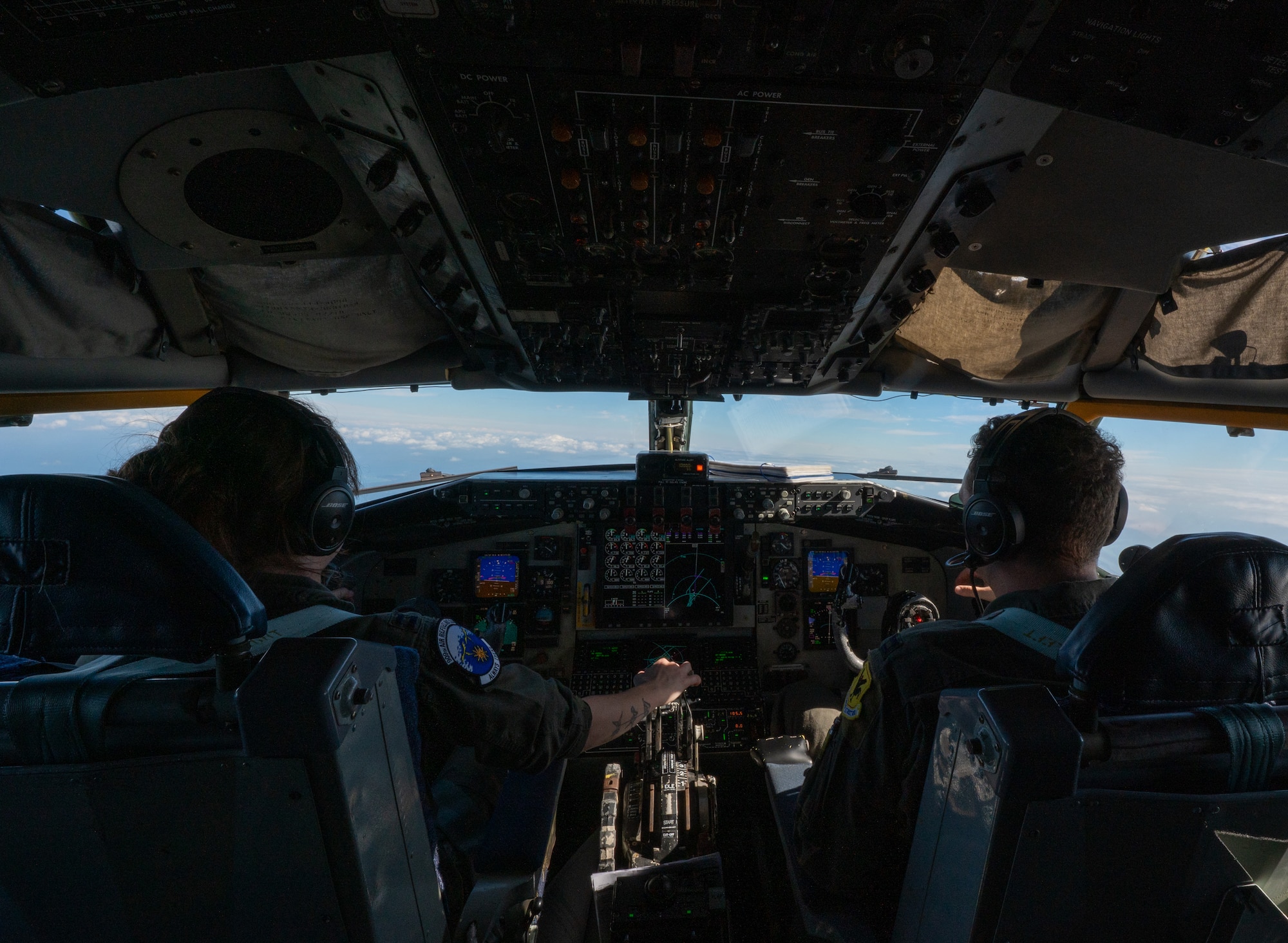 U.S. Air Force pilots fly a KC-135 Stratotanker over the Pacific Ocean.
