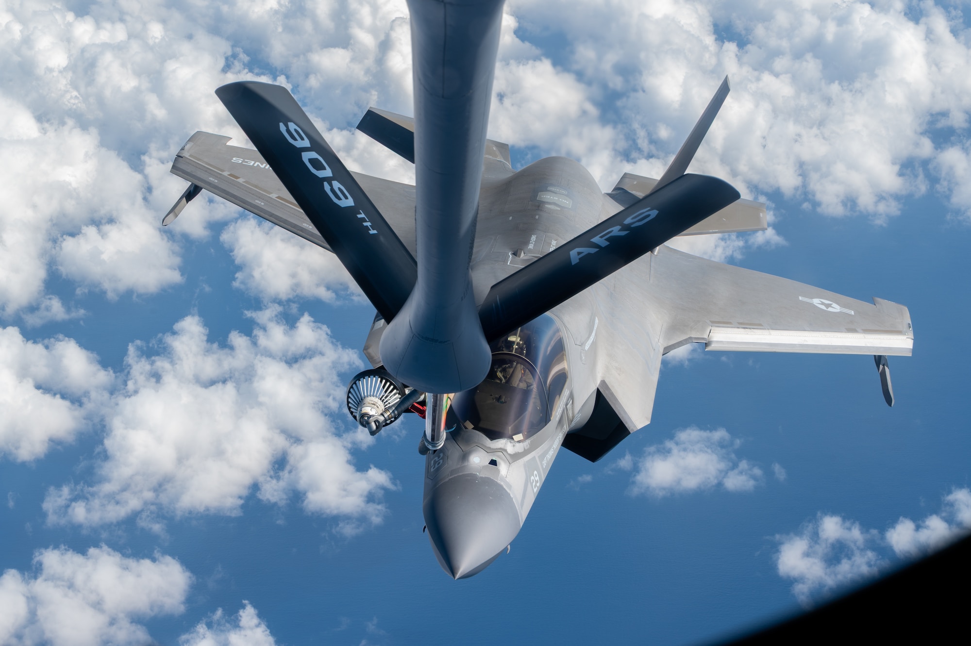 A USMC and USAF aircraft conduct aerial refueling operations.
