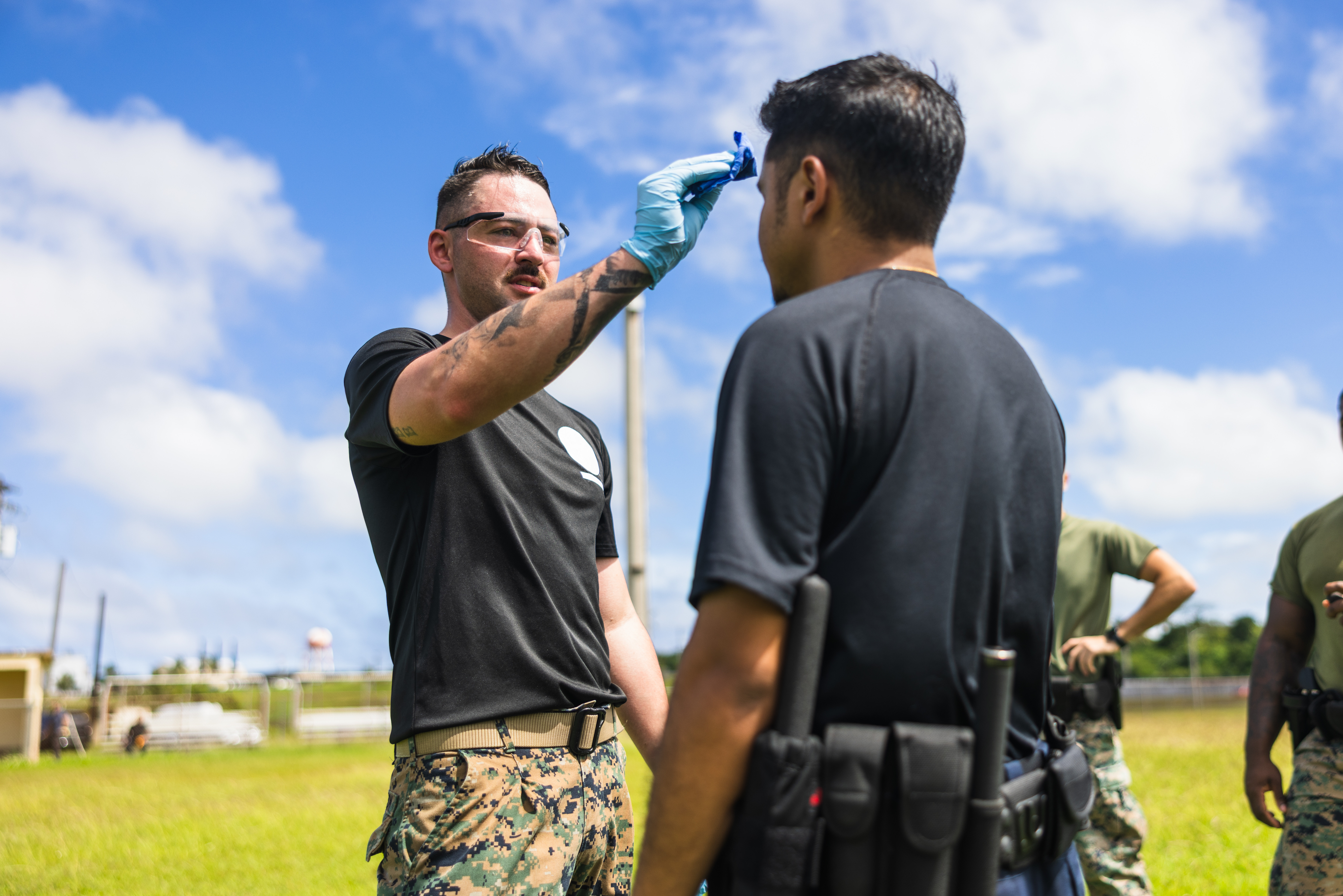 U.S. Marine Corps Staff Sgt. Brok McCuistion, military police, Provost Marshal’s Office, Marine Corps Base Camp Blaz, applies Oleoresin Capsicum spray during an OC Course on MCB Camp Blaz, Guam, Nov. 4, 2025. The training marks the first OC course conducted on MCB Camp Blaz, expanding the installation’s training capabilities. (U.S. Marine Corps photo by Sgt. Brayden Daniel)
