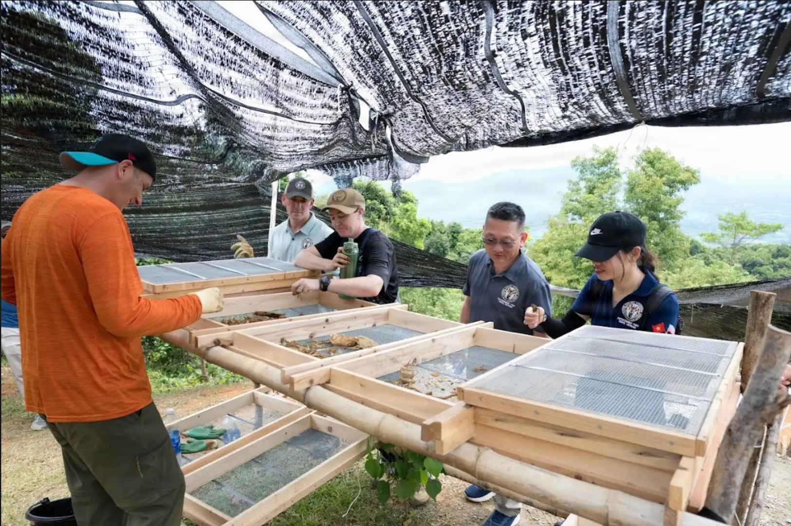 U.S. Army Lt. Col. Jason Kim, Detachment 2 Commander, Defense POW/MIA Accounting Agency, observes operations during an official visit to a recovery site in Vietnam, August 15, 2025.