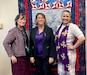 From the left, Alaska National Guard Warrior and Family Services Coordinator Octavia Thompson, AKNG Senior Enlisted Leader Command Sgt. Maj. Julie Small and AKNG Sexual Assault Response Coordinator Ashley Shelton pose for a photo during “Purple Thursday”, a Domestic Violence Awareness Month event Oct. 17, 2024. (Courtesy photo)
