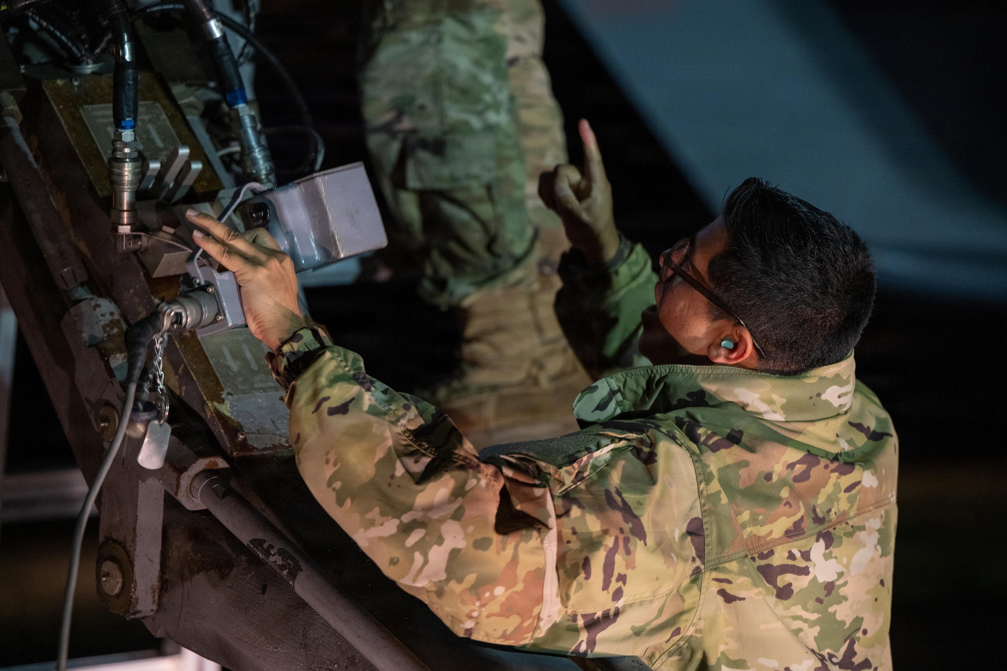 Weapons sit on the flightline before being loaded onto a B-1B Lancer