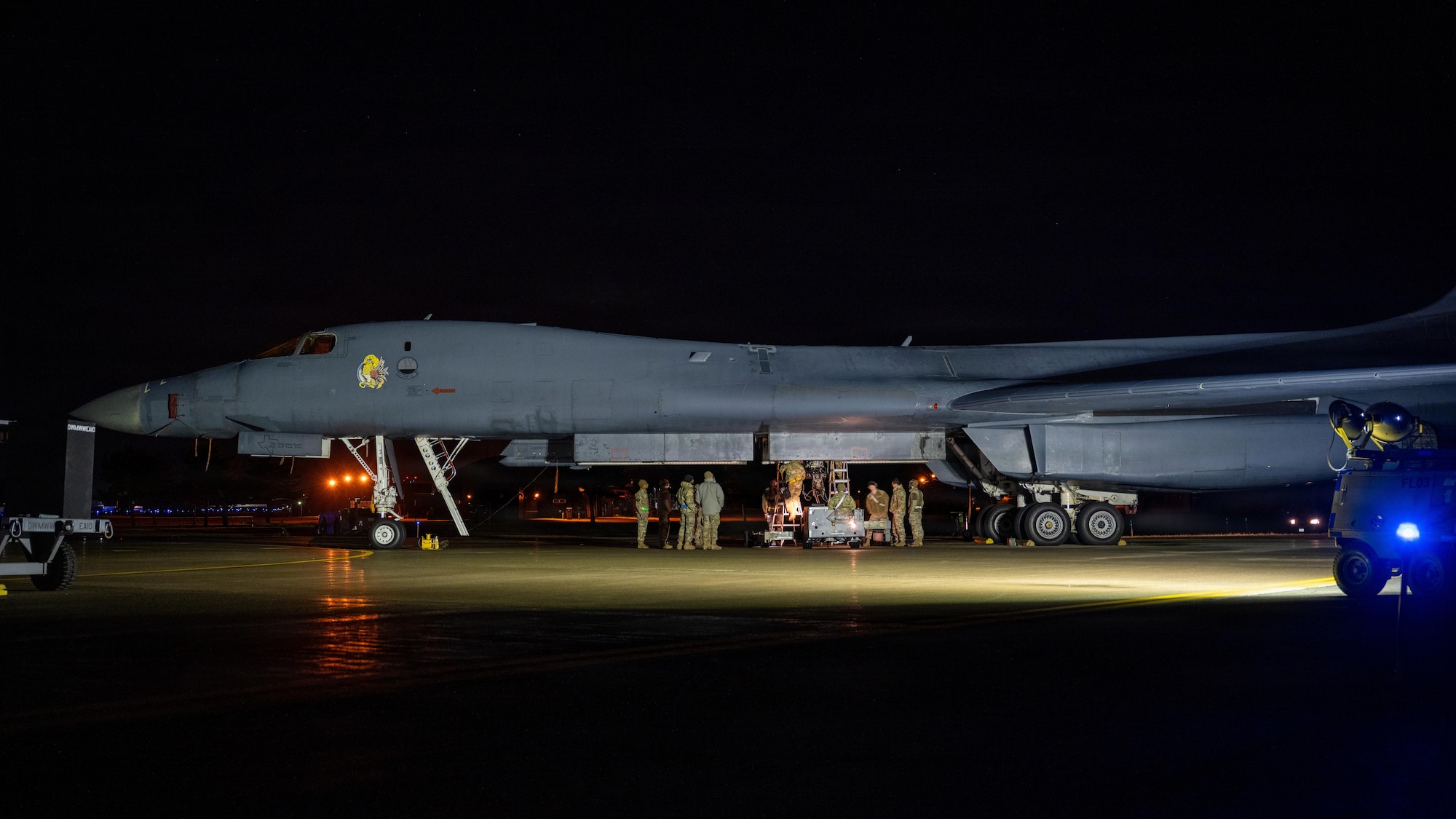 Weapons sit on the flightline before being loaded onto a B-1B Lancer