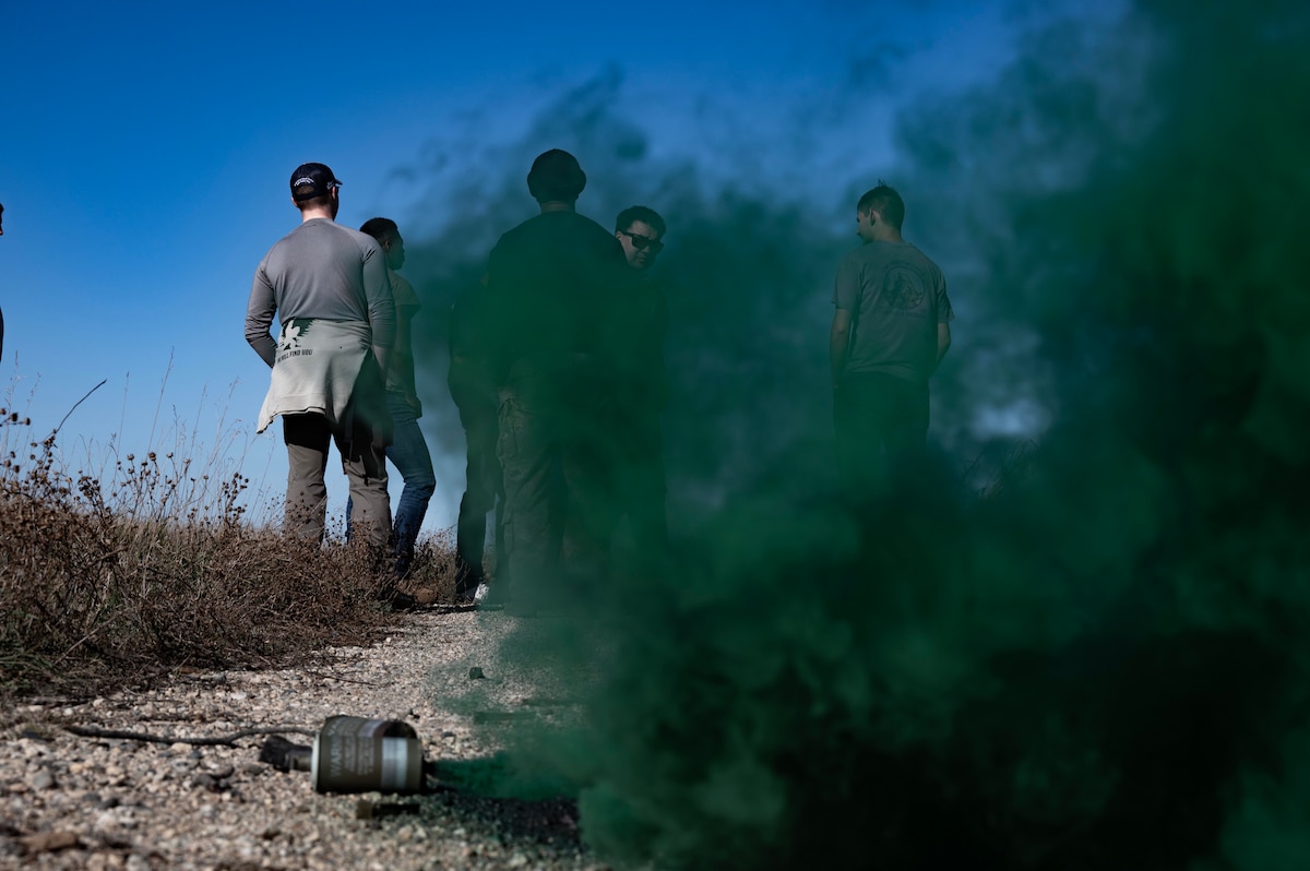 Team Minot Airmen participating in the combat survival training receive training on smoke signals at Garrison, North Dakota, Oct. 9, 2025. In order to prepare for possible hostile scenarios, aircrew members must finish survival, evade, resistance and escape training. (U.S. Air Force photo by Senior Airman Alyssa Bankston)