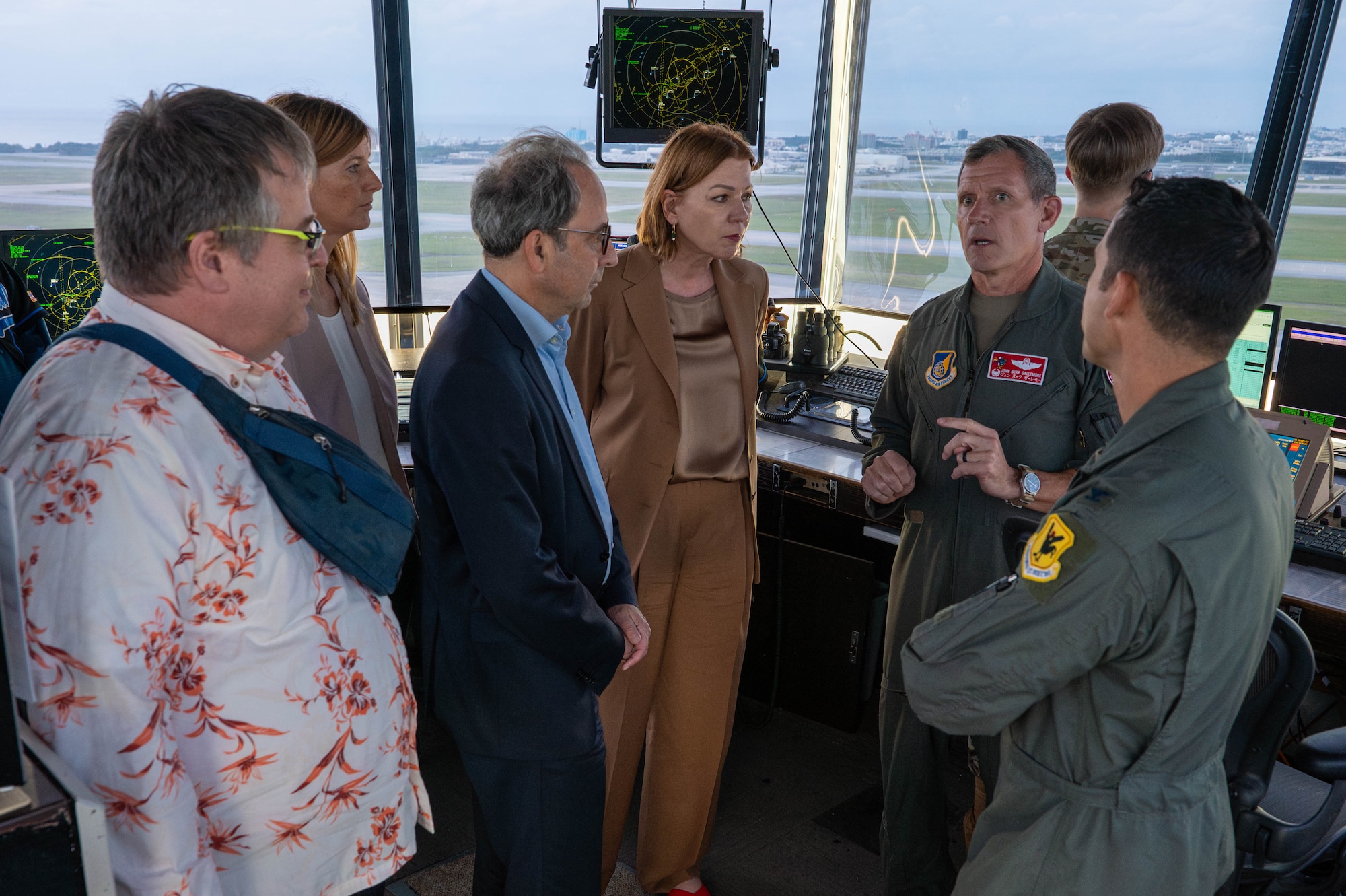 U.S. Air Force Brig. Gen. John Gallemore, right, 18th Wing commander, briefs Petra Sigmund, Director General for East Asia, Southeast Asia and the Pacific at the Federal Foreign Office, and her team, while touring the air traffic control tower during a familiarization tour of Kadena Air Base, Japan, Nov. 21, 2025. The visit offered an opportunity to see how Kadena’s capabilities integrate with allied efforts across the Indo-Pacific. (U.S. Air Force photo by Airman Nathaniel Jackson)
