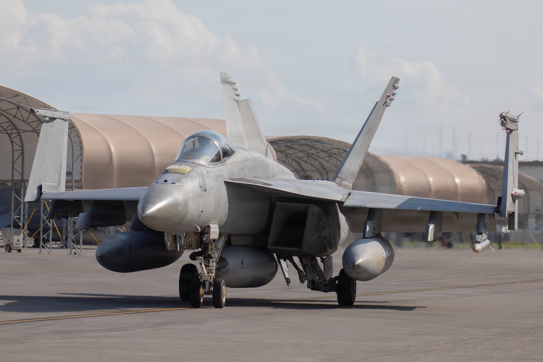A U.S Navy EA-18G Growler aircraft assigned to Electronic Attack Squadron (VAQ) 141, Carrier Air Wing (CVW) 5, taxis on the runway during a carrier qualification at Marine Corps air Station Iwakuni, Japan, Oct. 1, 2025. CVW-5 conducts a carrier qualification as a pre-deployment exercise to ensure pilots are ready and equipment is in top condition. (U.S. Marine Corps photo by Lance Cpl. Siwan Lewis)