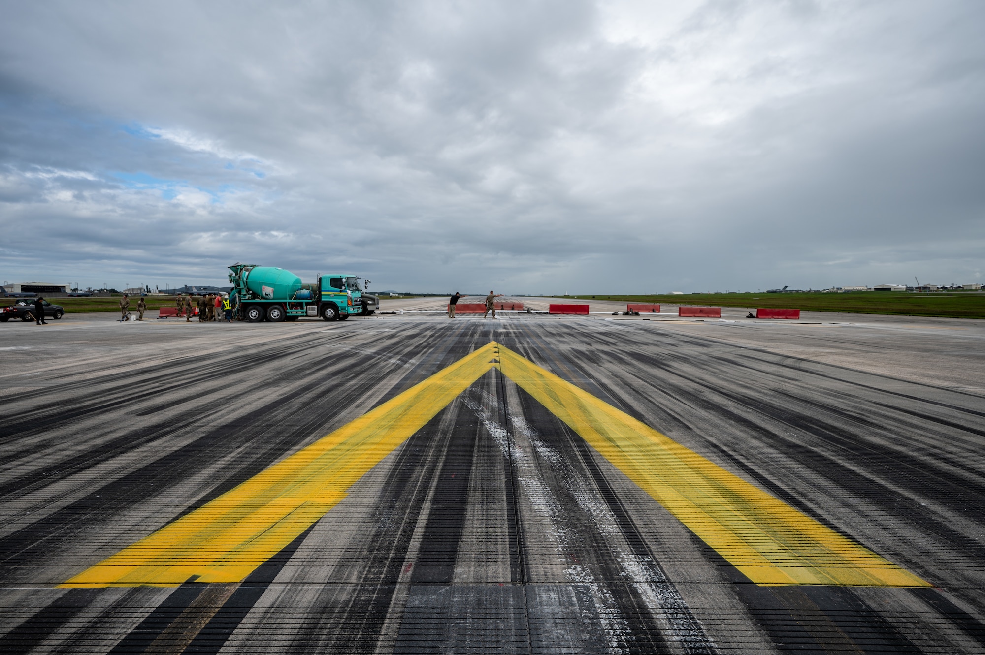 U.S. Air Force Airmen operate heavy equipment on the runway during full-depth pavement repair and displaced threshold implementation at Kadena Air Base, Nov. 14, 2025. The project represents one of the largest in-house airfield repairs completed at Kadena this year. (U.S. Air Force photo by Airman 1st Class Francisco Huerta)