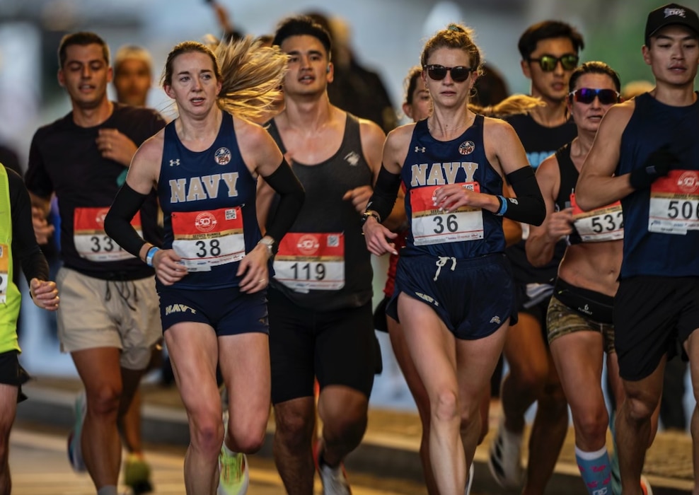 WASHINGTON, D.C., UNITED STATES - Lt. Megan Walsh (second from right/#36), psychiatry resident at Navy Medicine Readiness and Training Command (NMRTC) San Diego and All-Navy Marathon Team Captain, pushes through mile after mile at the Armed Forces National Marathon Championship in Washington D.C., Oct. 26, 2025. Walsh previously took the individual gold medal in 2024, and this year secured the bronze, leading the Navy Women’s Marathon team to their second consecutive victory. (U.S. Navy photo contributed)