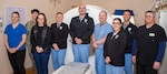 Radiology Department staff assigned to Naval Hospital Bremerton take a pause from their diagnostic exam cause after wrapping up National Radiologic Technology Week in early November to commemorate the essential contributions of military radiologic technologists while marking the 130th anniversary of Wilhelm Conrad Roentgen’s X-ray discovery. This year’s theme, “The Kaleidoscope of Radiologic Technology,” emphasized the multifaceted role of all Defense Health Agency military treatment facility Radiology Department staff who support operational readiness, medical diagnosis, and military healthcare (Official Navy photo by Mass Communication Specialist 2nd Class Jennifer Benedict, NHB/NMRTC Bremerton public affairs).