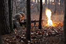 U.S. Marine Corps students with Company D, Basic Officer Course 4-25, The Basic School, Training Command, provide suppressive fire with an M240B machine gun during the Warfighting Field Exercise at Marine Corps Base Quantico, Virginia, Nov. 19, 2025. The WARFEX serves as the culminating event at TBS, evaluating students’ proficiency in decision-making, small-unit tactics, and leadership as they operate under sustained physical and mental pressure in a realistic warfighting scenario. (U.S. Marine Corps photo by Cpl. Joshua Barker)