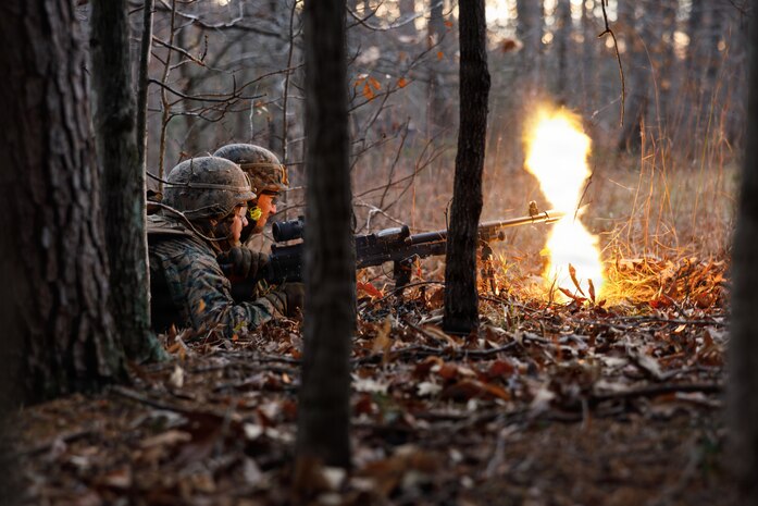 U.S. Marine Corps students with Company D, Basic Officer Course 4-25, The Basic School, Training Command, provide suppressive fire with an M240B machine gun during the Warfighting Field Exercise at Marine Corps Base Quantico, Virginia, Nov. 19, 2025. The WARFEX serves as the culminating event at TBS, evaluating students’ proficiency in decision-making, small-unit tactics, and leadership as they operate under sustained physical and mental pressure in a realistic warfighting scenario. (U.S. Marine Corps photo by Cpl. Joshua Barker)