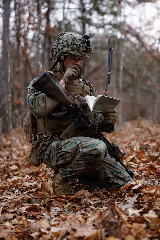 A U.S. Marine Corps student with Company D, Basic Officer Course 4-25, delivers a situation report during the Warfighting Field Exercise at Marine Corps Base Quantico, Virginia, Nov. 19, 2025. The WARFEX serves as the culminating event at TBS, evaluating students’ proficiency in decision-making, small-unit tactics, and leadership as they operate under sustained physical and mental pressure in a realistic warfighting scenario. (U.S. Marine Corps photo by Cpl. Joshua Barker)