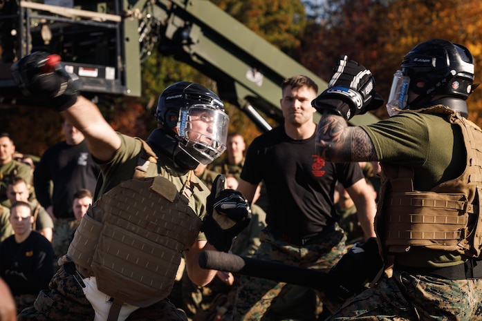 U.S. Marines with The Basic School, Training Command, compete in a weapons free-sparring event during a field meet at Marine Corps Base Quantico, Virginia, Oct. 31, 2025. During the field meet, Marines with TBS participated in physical training and competitions to build camaraderie and celebrate the Marine Corps' 250th Birthday. (U.S. Marine Corps photo by Cpl. Joshua Barker)