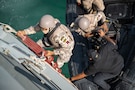 DOHA, Qatar (Nov. 18, 2025) A Qatari marine, assigned to the Qatari Emiri Navy, embarks onto the Qatari Barzan-class fast attack missile craft Al Deebel (Q07) during a close quarters combat training during Exercise Ferocious Falcon 6 in the U.S. Central Command area of responsibility. Ferocious Falcon 6 is a biennial, Qatar-hosted multinational joint exercise designed to enhance lethality and combat efficiency among U.S. and allied forces. (U.S. Navy photo by Mass Communication Specialist 2nd Class Iain Page)