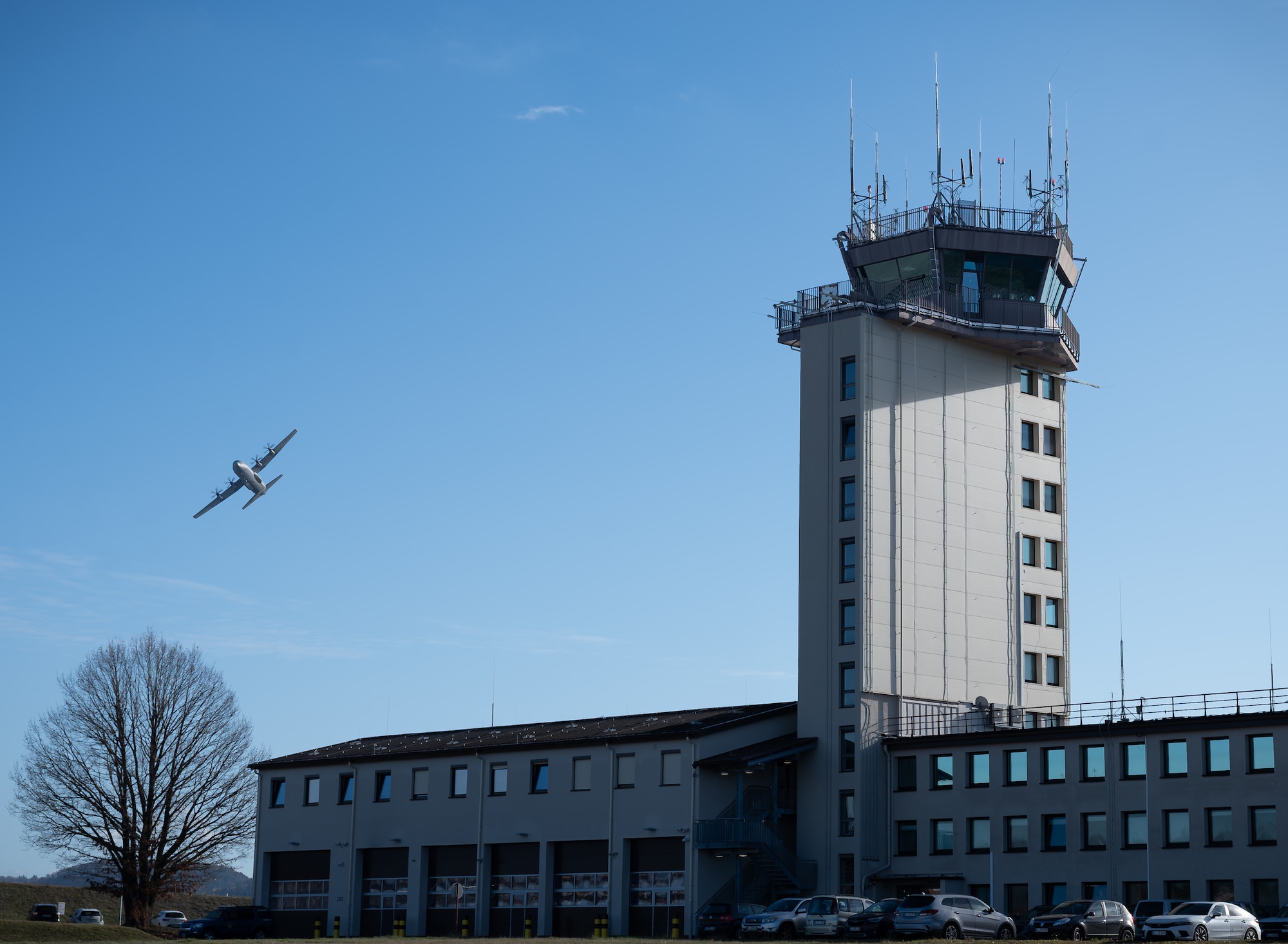 The air traffic control tower at Ramstein Air Base, Germany, controls approximately 26,000 flights a year. The tower maintains direct visual control of the airfield, to include aircraft, personnel and vehicles, with approximately 50 cubic miles of airspace. (U.S. Air Force photo by Senior Airman Jared Lovett)