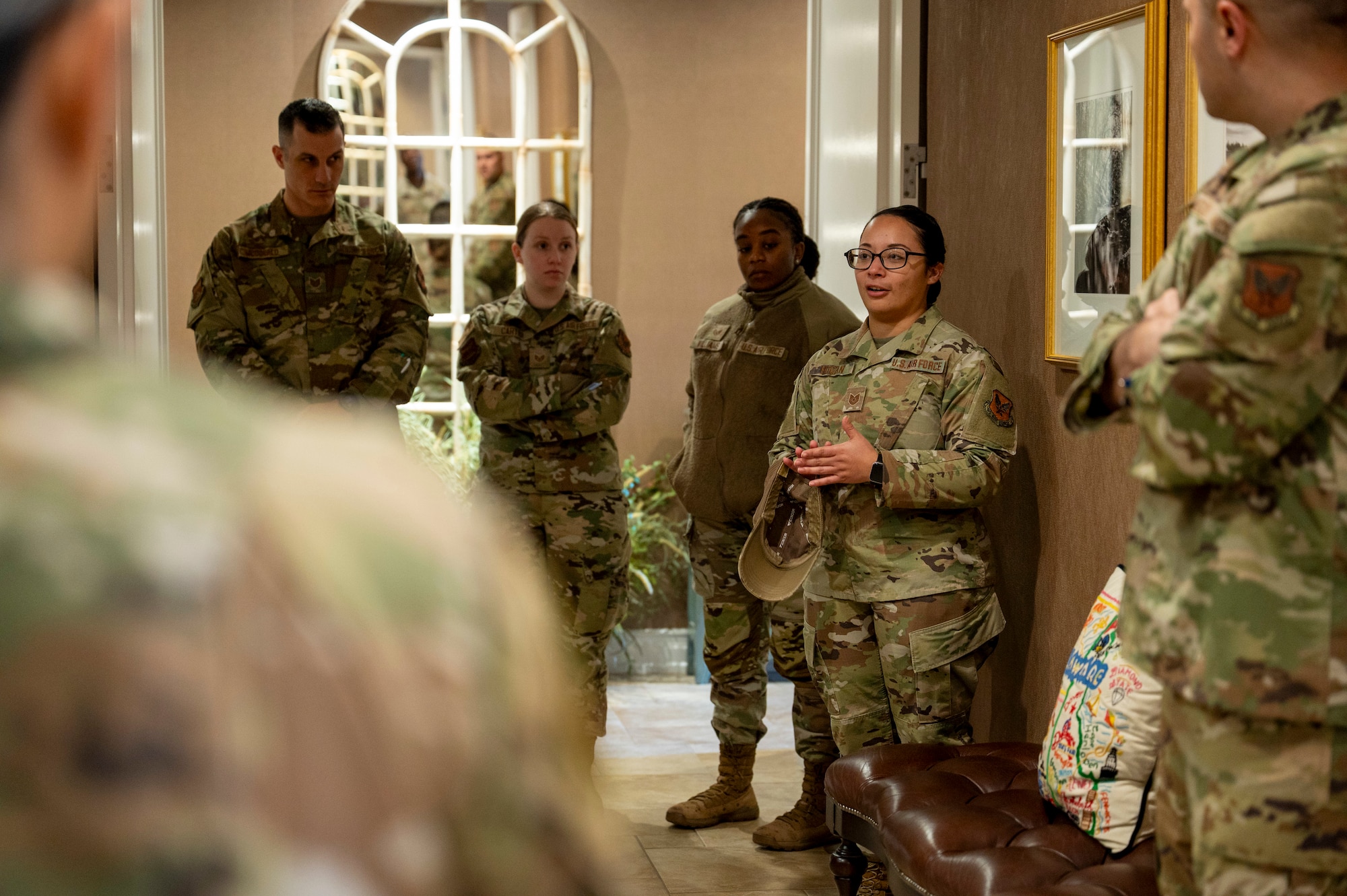 U.S. Air Force Tech. Sgt. Samantha Hogan, Air Force Mortuary Affairs Operations Fisher House for Families of the Fallen section chief, explains procedures during an in-house inspection, Dover Air Force Base, Delaware, Nov. 18, 2025. The Fisher House for Families of the Fallen at Dover AFB, is a unique facility among the Fisher House Foundation's other locations. It is the only one of its kind, designed for families of the fallen and managed exclusively by uniformed personnel. It is designed to provide short-term, on-base lodging to families who travel to Dover AFB to witness the dignified transfer of their loved one. (U.S. Air Force photo by Staff Sgt. Frank Rohrig)