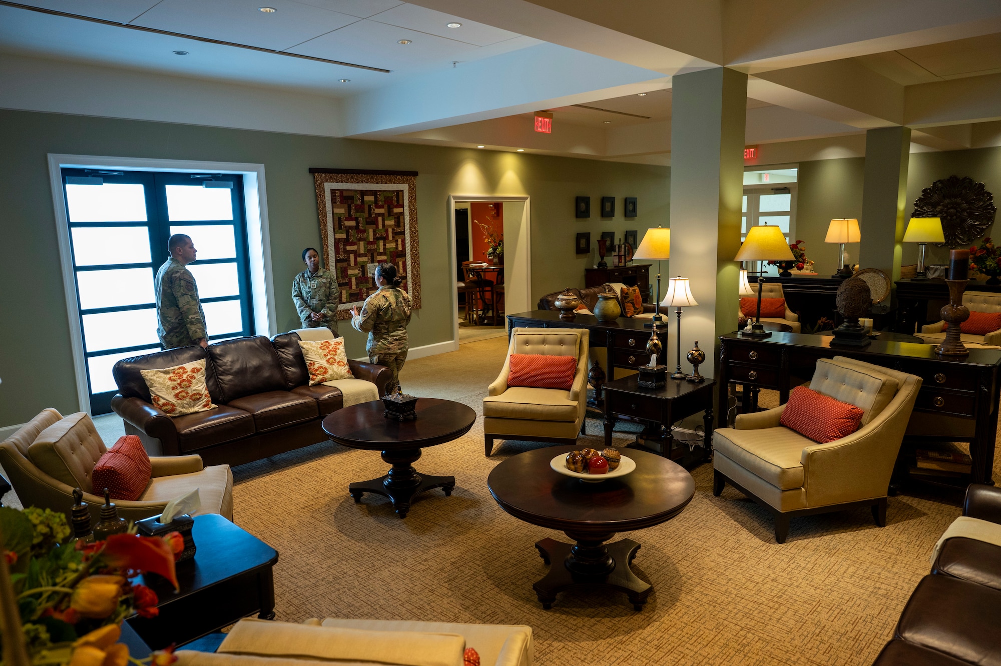 U.S. Air Force Mortuary Affairs Operations members discuss plans for a future tour in the Center for Families of the Fallen, Dover Air Force Base, Delaware, Nov. 18, 2025. The 6,339 square foot renovated facility includes segregated areas and rooms for families to use for privacy and separation, a cafe area with snacks and beverages, a meditation room, baby changing stations in both restrooms, a private nursing area in the women's restroom, a children's activity room with a chalkboard wall, games and toys and a separate area with TVs and gaming systems. (U.S. Air Force photo by Staff Sgt. Frank Rohrig)