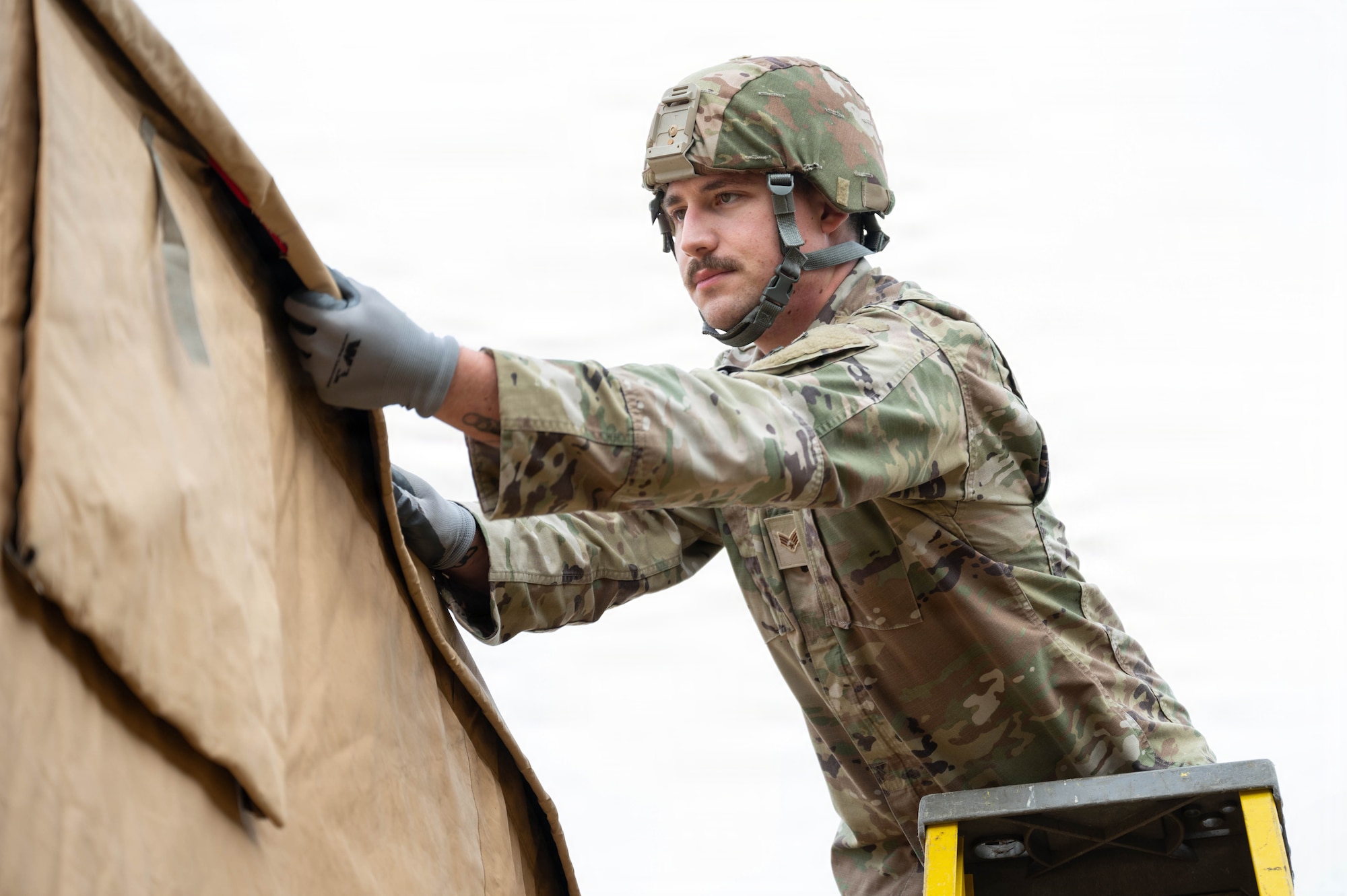 Photo of an Airman working on a generator.