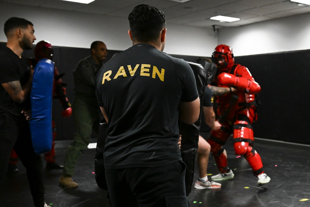 U.S. Air Force protective services specialists, or “Ravens,” assigned to the 816th Security Forces Squadron, conduct a sparring demonstration at Joint Base Andrews, Maryland.