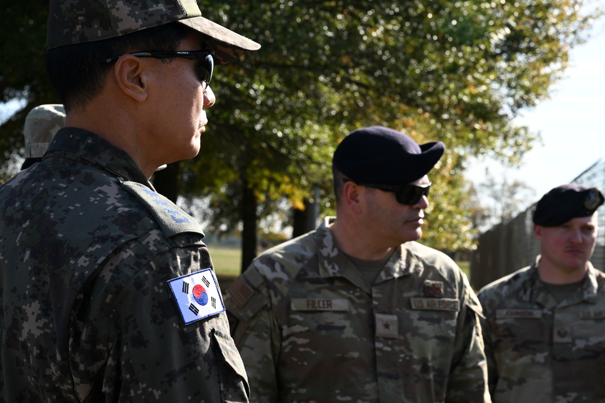 U.S. Air Force Brig. Gen. Brian A. Filler, Director of Security Forces, watch a 316th Security Forces Group military working dog demonstration at Joint Base Andrews, Maryland.