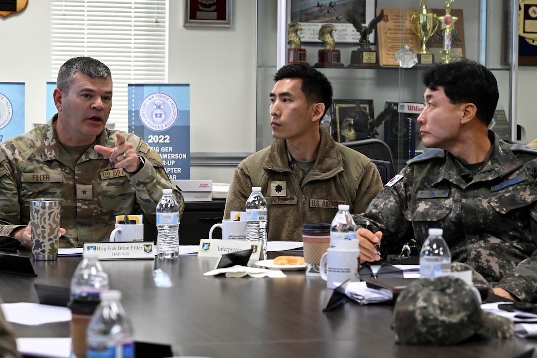 U.S. Air Force Brig. Gen. Brian A. Filler, Director of Security Forces, left, speaks with Republic of Korea Air Force Col. Jongsung Woo.