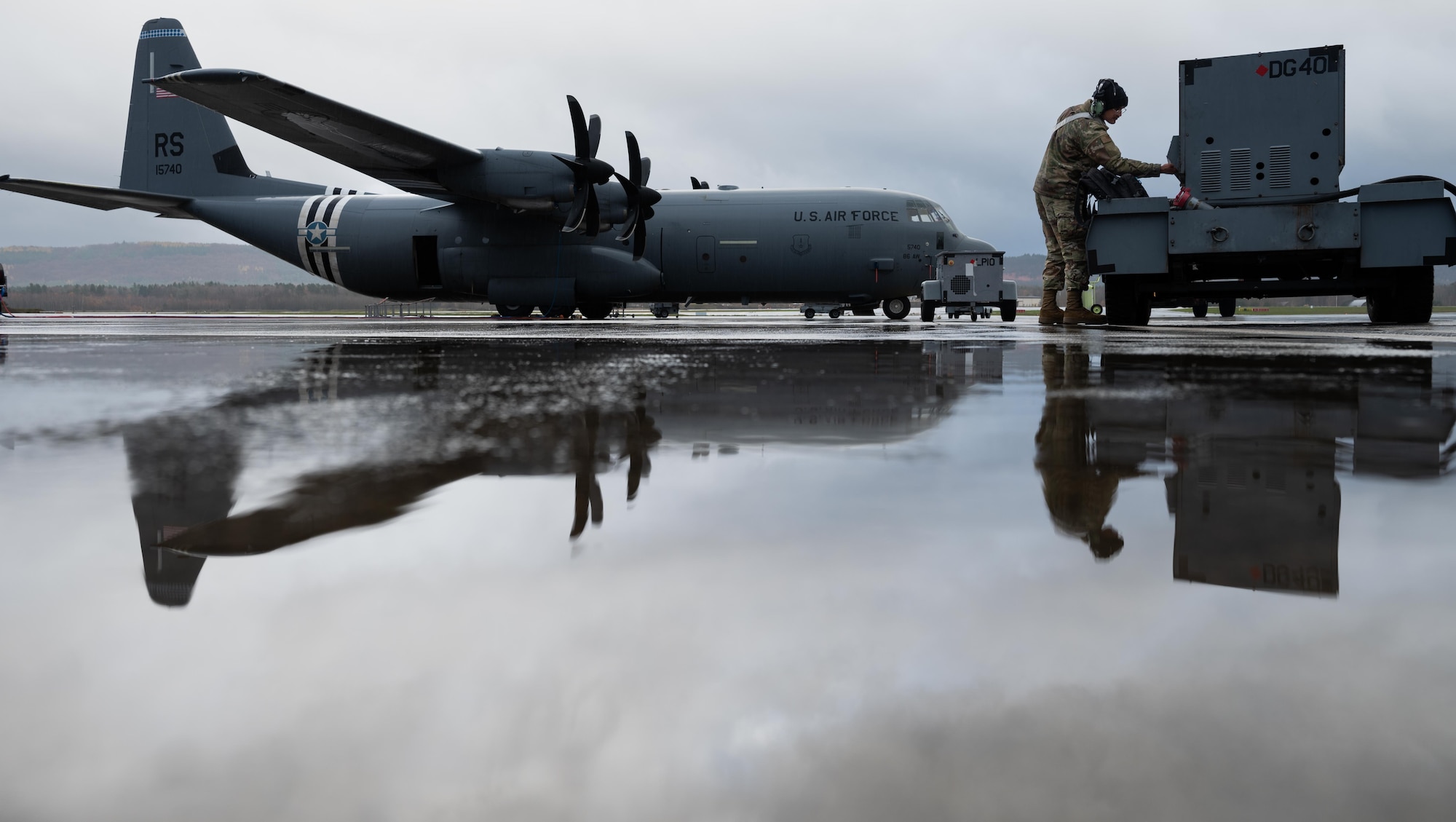 Airmen inspect C-130 aircraft