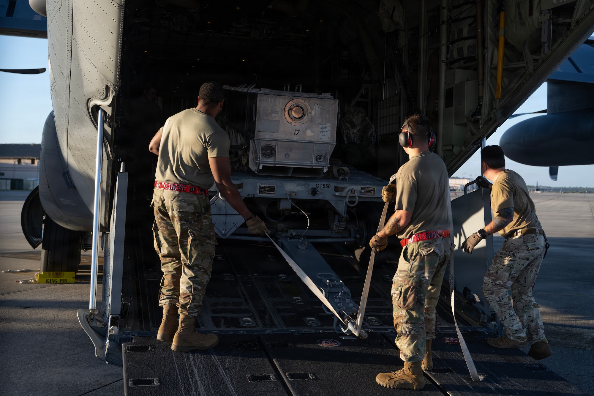 U.S. Air Force loadmasters and munitions systems specialists assigned to the 1st Special Operations Wing load inert munitions on a MC-130J Commando II during an Ammo Advanced Performance Experience at Hurlburt Field, Florida, Nov. 5, 2025.