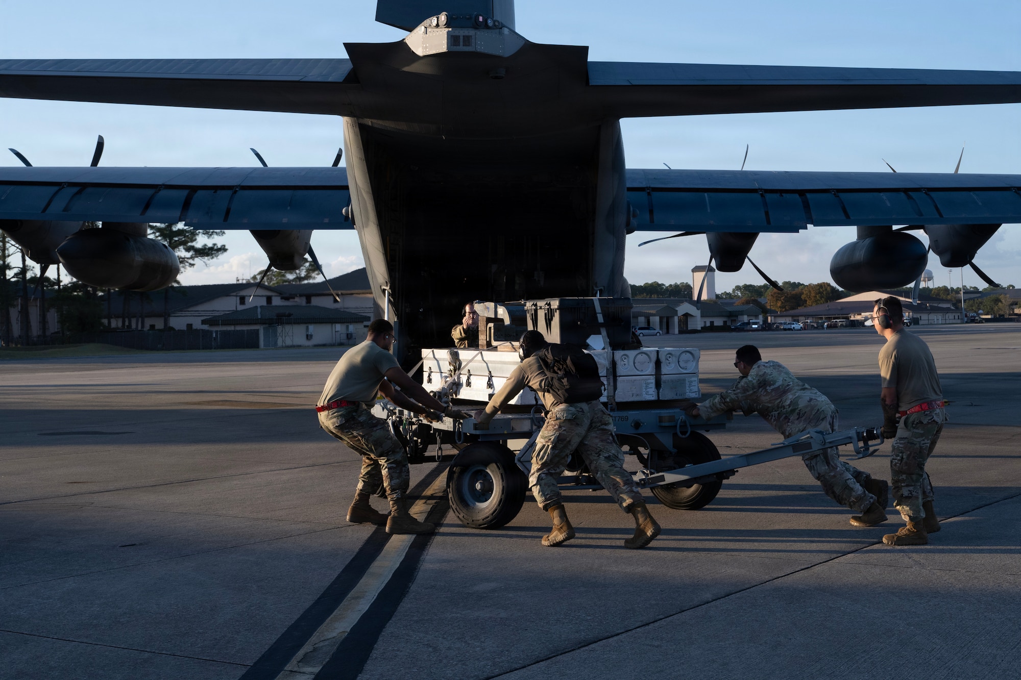 U.S. Air Force munitions systems specialists assigned to the 1st Special Operations Wing load inert munitions on a MC-130J Commando II during an Ammo Advanced Performance Experience at Hurlburt Field, Florida, Nov. 5, 2025.