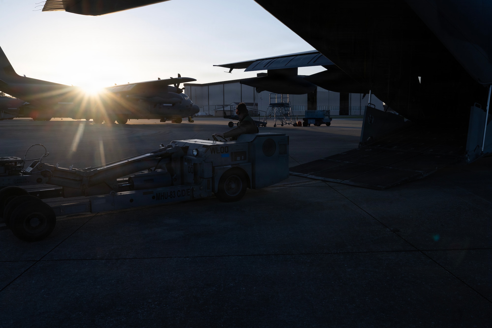 A U.S. Air Force munitions systems specialist assigned to the 1st Special Operations Wing drives a bomb lift truck onto a MC-130J Commando II during an Ammo Advanced Performance Experience at Hurlburt Field, Florida, Nov. 5, 2025.