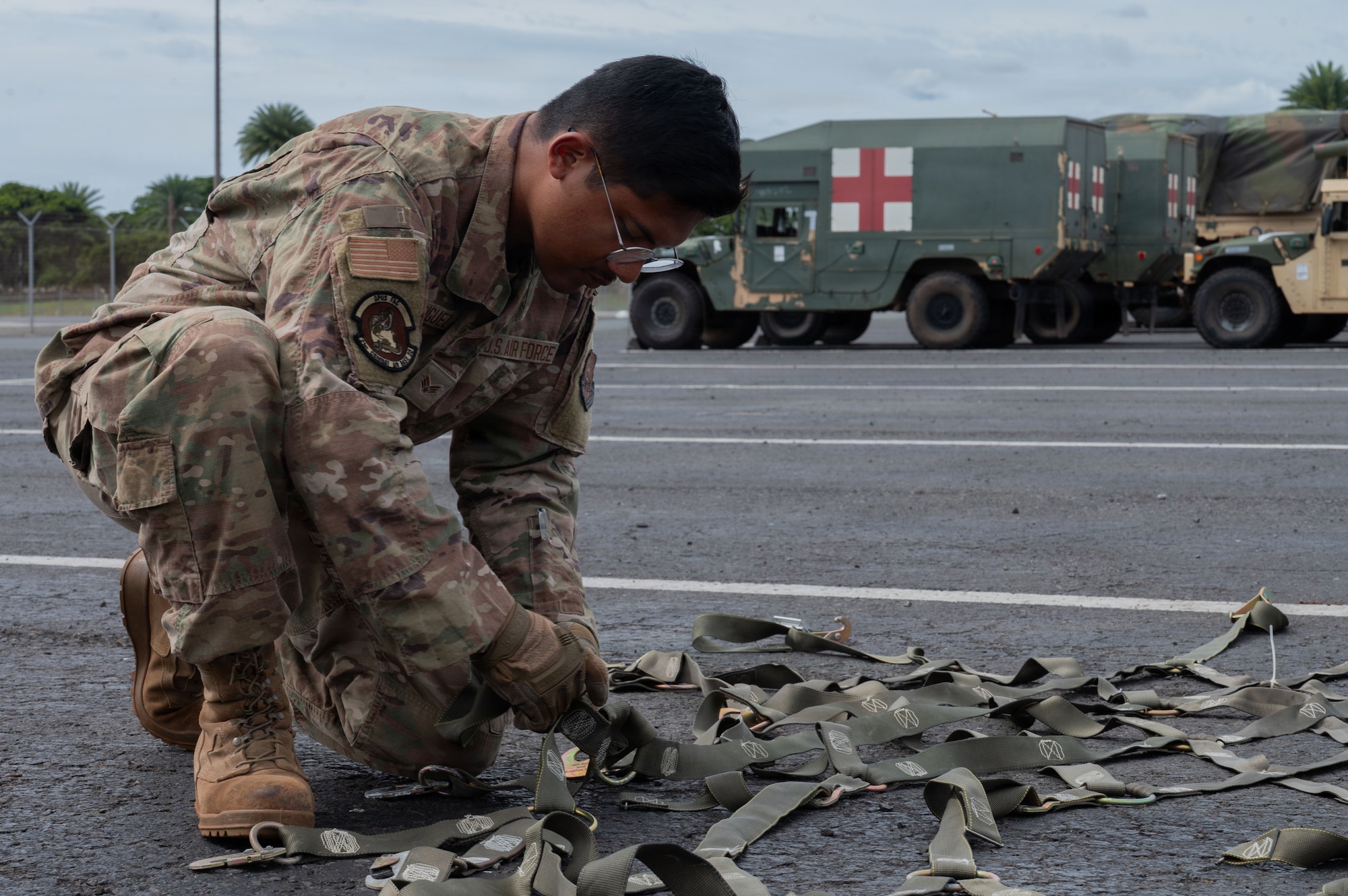 U.S. Air Force Senior Airman Brandon Rodriguez, a power production journeyman with the 21st Combat Air Base Squadron, prepares pallet netting for deployment to a forward operating site during Joint Pacific Multinational Readiness Center (JPMRC) 26-01 at Joint Base Pearl Harbor-Hickam, Hawaii, Nov. 2, 2025. As part of JPMRC 26-01, the 21st Air Task Force and 21st CABS conducted advanced 300-level training within the Air Force Force Generation cycle, certifying their readiness to deploy, establish operations, and sustain combat airpower in contested environments. (U.S. Air Force photo by Senior Airman Alondra Cristobal Hernandez)